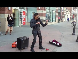 playing the violin of a street musician